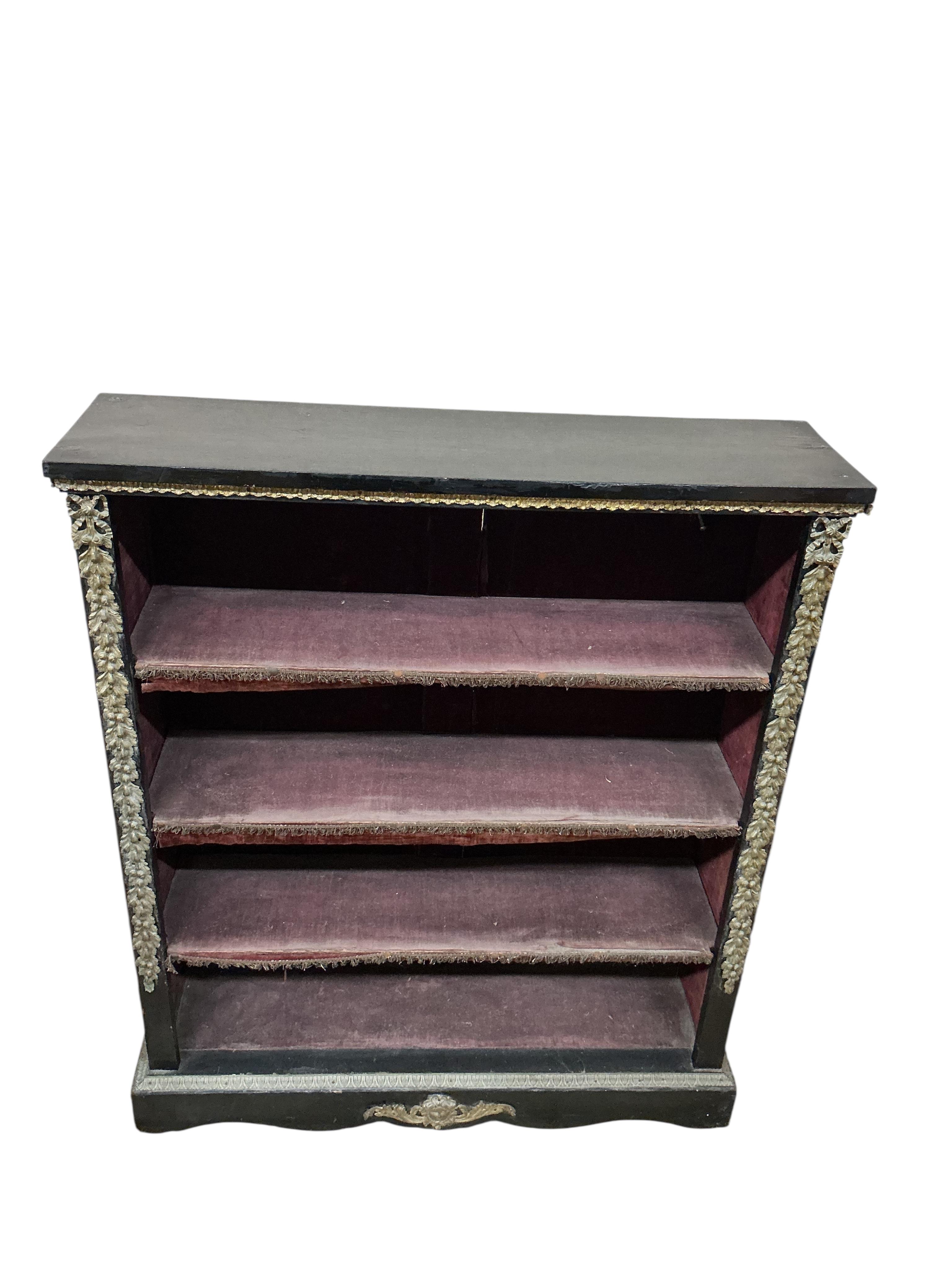 A Victorian gilt metal mounted ebonised open bookcase, width 96cm, depth 26cm, height 113cm